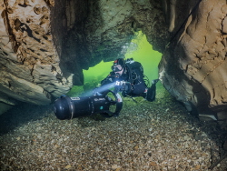 Entrance of a cave in the Cele river in France. by Brenda De Vries 